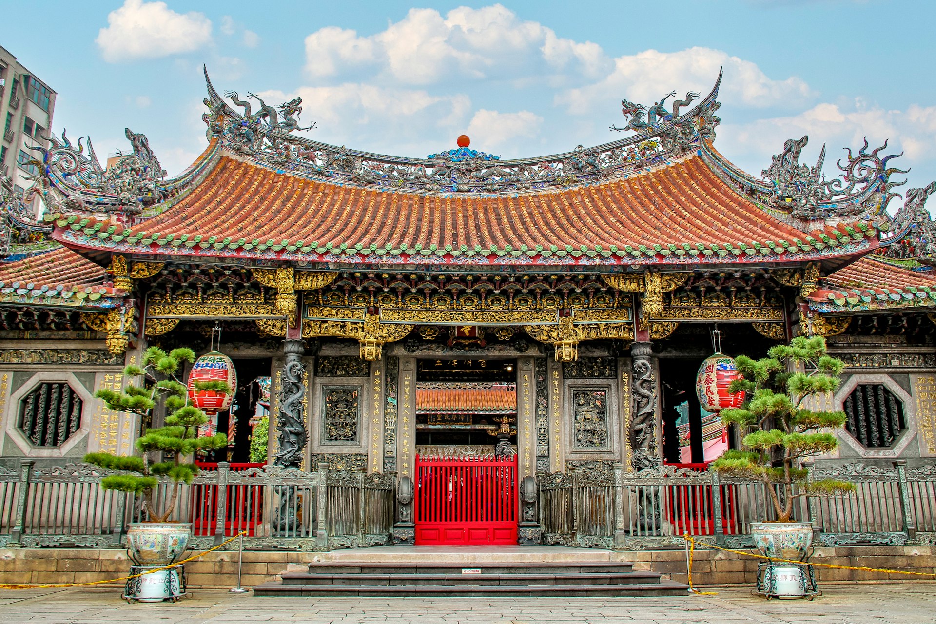 a chinese building with a red door and a red door